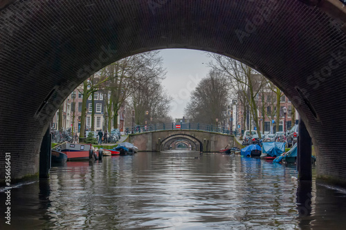 Photography A bridge over the narrow canals of Amsterdam in Holland