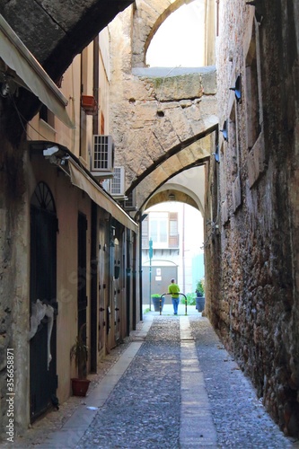 evocative image of an ancient street in the historic center of Palermo in Italy