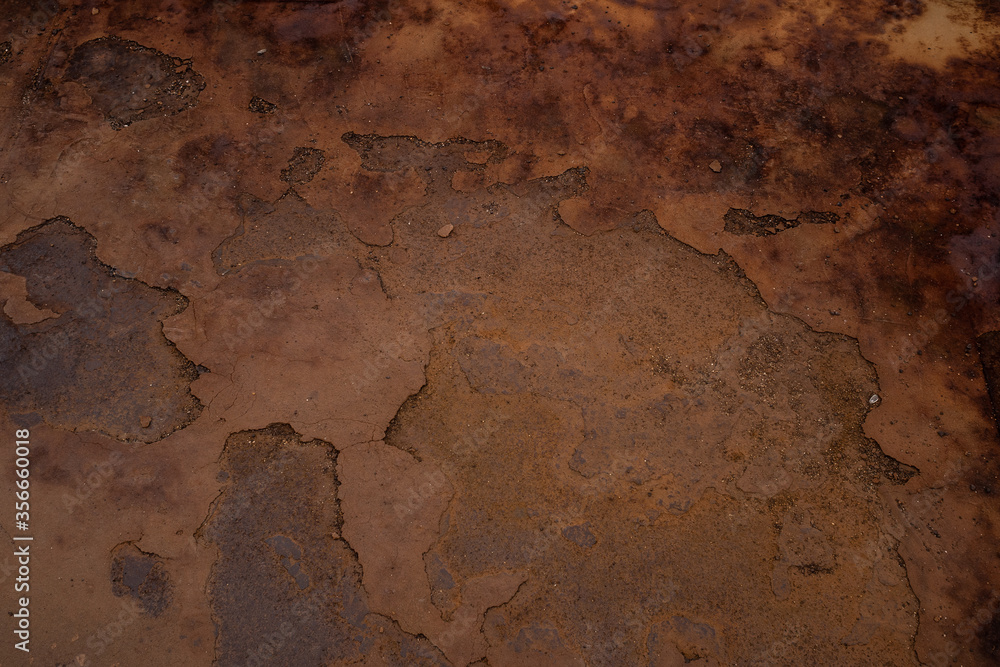 Fototapeta premium textured and embossed surface in brown, earth and rusty tones