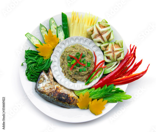 Fish mackerel dried paste chili spicy with fresh and boiled vagetable ,grill Thai mackerel.Thai cuisine,Thaispicy healthy food or dietfood top view  isolated on white background photo