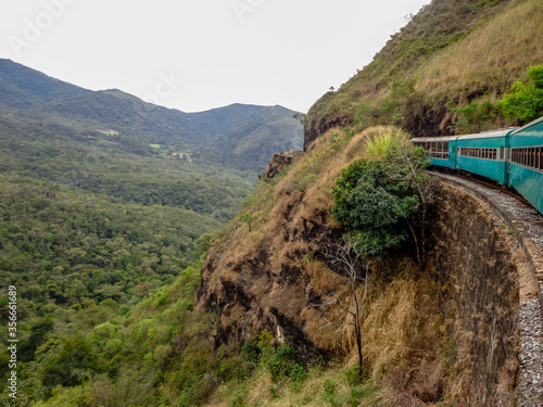Train on a steep hill between the historical cities of Ouro Preto and Mariana, Minas Gerais, Brazil