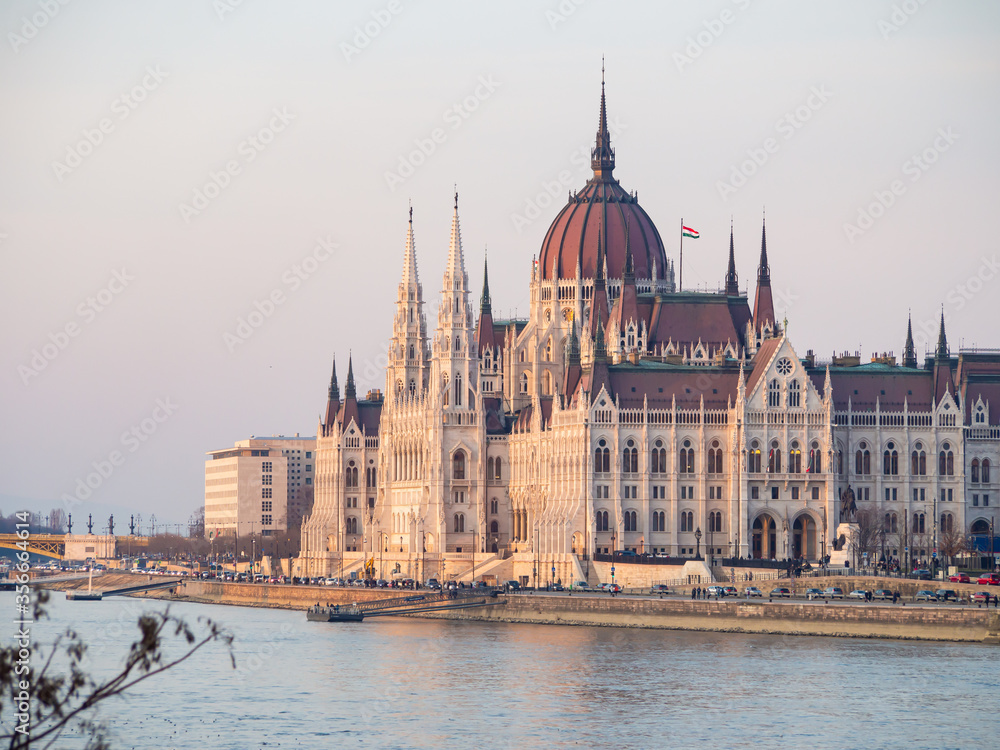 Budapest parliament building at danube river at sunset in spring 