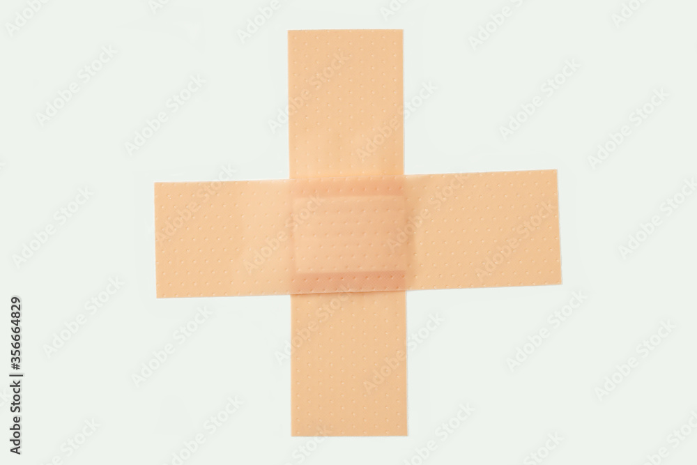 band-aid cross. medical elastic patch. bandaid stripe on white background. adhesive bandage, medical plaster. band-aid cross. medical elastic patch. bandaid stripe on white background. adhesive bandage, medical plaster.
