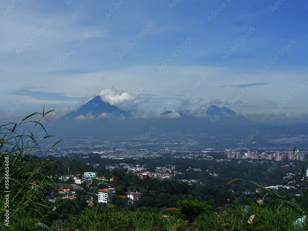 Vista over Guatemala City with Volcanos in the Background on a sunny morning