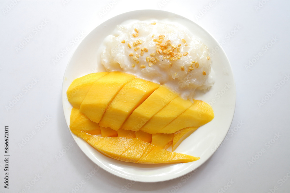 Dish of sweet sticky rice with Mango and coconut milk Dish of sweet sticky rice with Mango and coconut milk