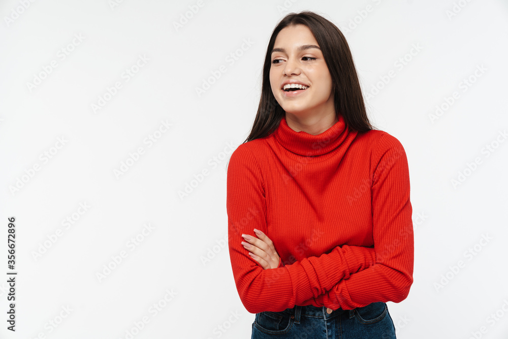 Photo of joyful woman in red sweater posing and laughing at camera Photo of joyful woman in red sweater posing and laughing at camera