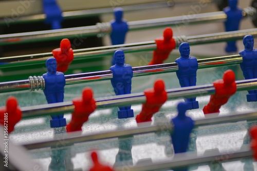 Table football, also known as table soccer or foosball in is a table-top game close up view selective focus