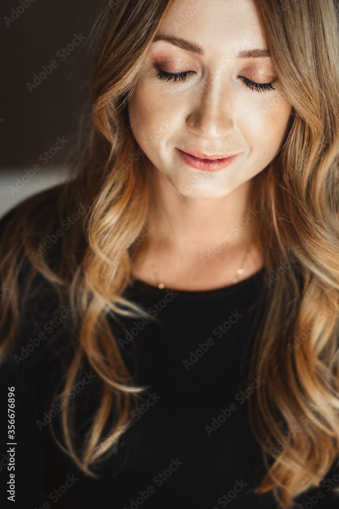 Portrait of a beautiful young woman with long hair. Naturalness. Eyes are closed. Portrait of a beautiful young woman with long hair. Naturalness. Eyes are closed.