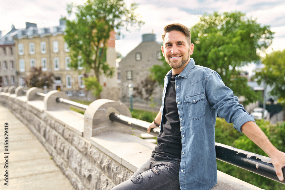 Fashionable guy having good time on the city background Fashionable guy having good time on the city background