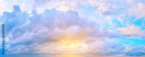 Panorama of sunset sky with bright sun