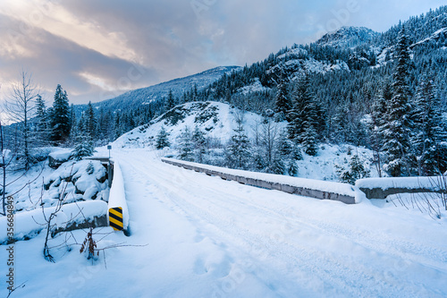 A snow covered access road bridge in the British Columbia backcountry