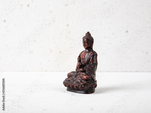 Photography photo of wooden buddha statue from the front
