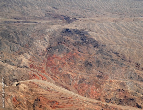 Aerial view of canyons at the Nevada dessert seen from an airplane window