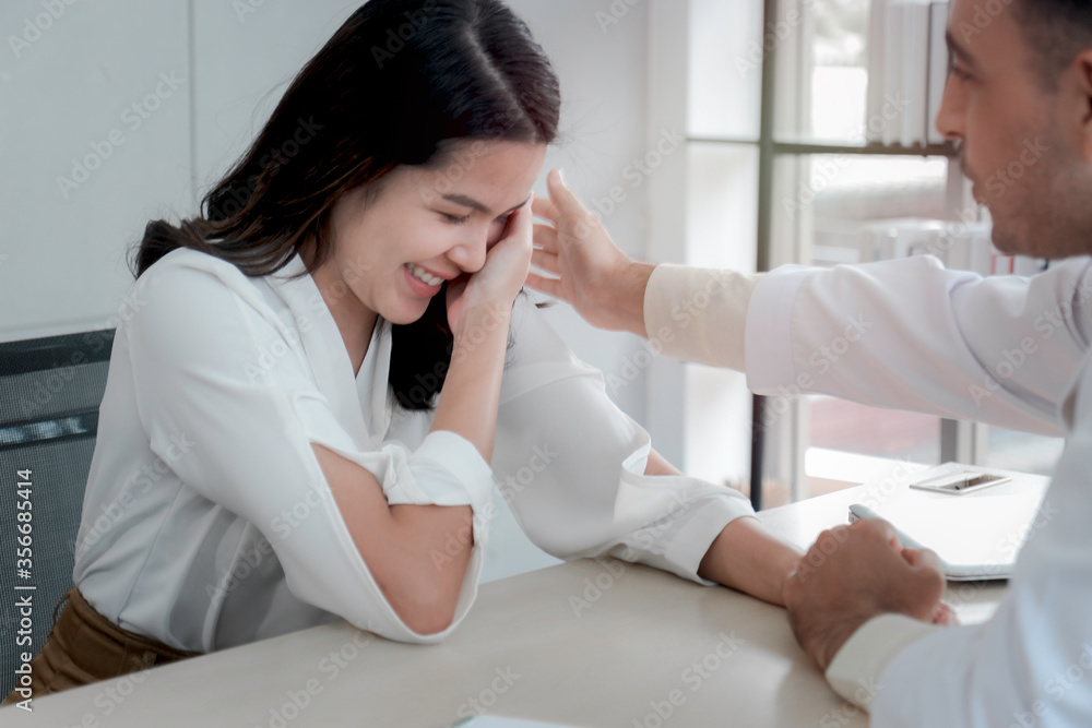Depressed patient having consultation with doctor, woman getting upset, psychiatrist holding patient hands, put hand on her shoulders to comfort, she feeling better, mental health concept Depressed patient having consultation with doctor, woman getting upset, psychiatrist holding patient hands, put hand on her shoulders to comfort, she feeling better, mental health concept