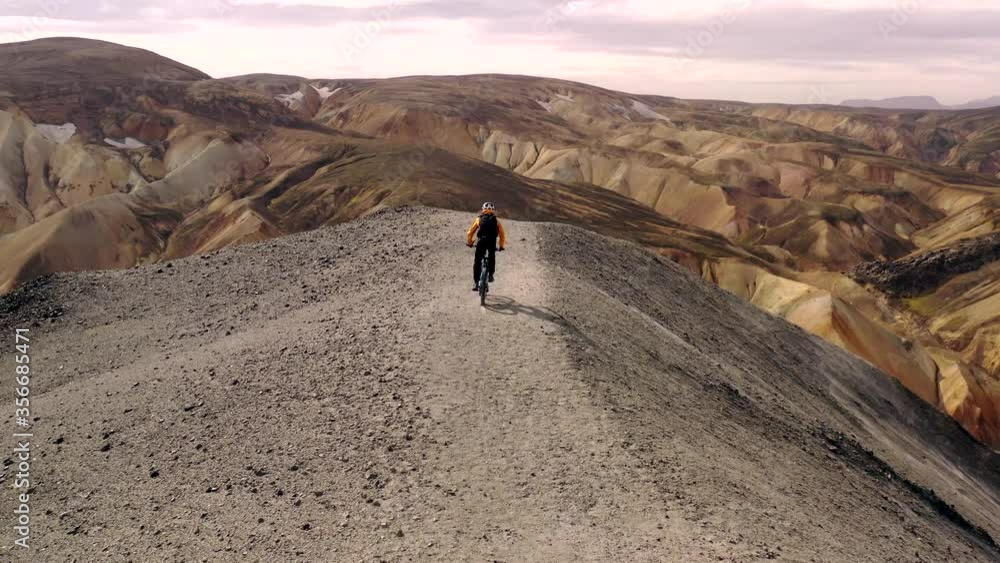 Amazing aerial drone shot of people riding on a path in Iceland Amazing aerial drone shot of people riding on a path in Iceland