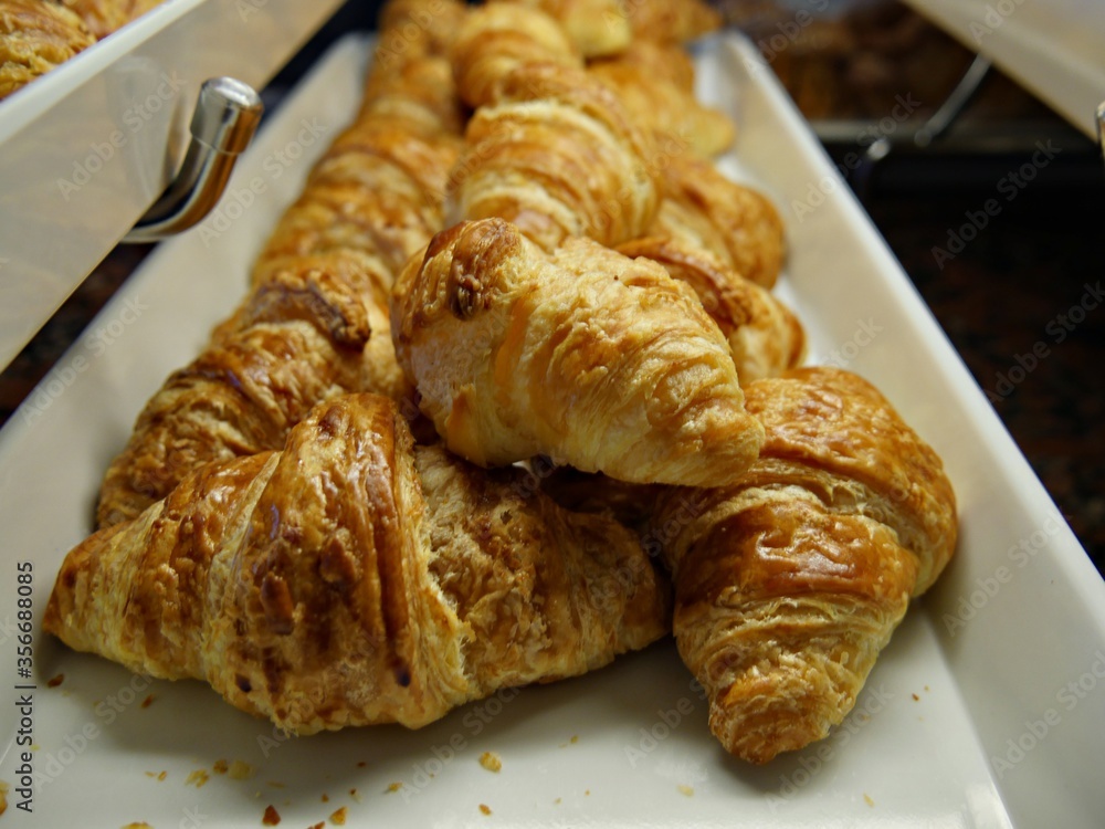 Freshly baked butter croissants at a breakfast buffet Freshly baked butter croissants at a breakfast buffet