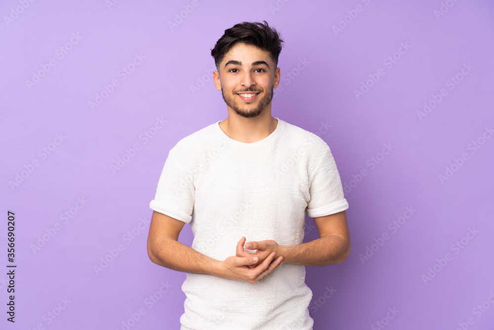 Fototapeta premium Arabian handsome man over isolated background laughing