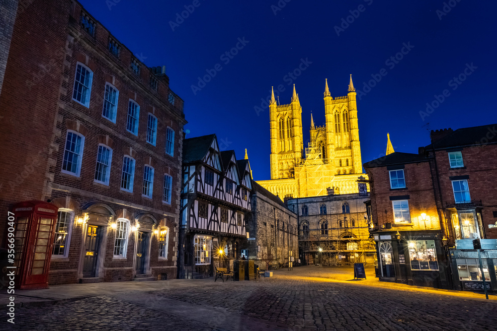 Ancient streets of historical city Lincoln, fantastic adventure travel destination or holiday vacation to view picturesque scenery day or night, sunrise or sunset