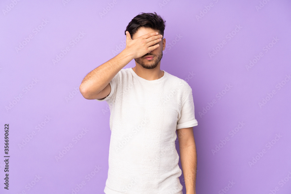 Arabian handsome man over isolated background covering eyes by hands. Do not want to see something Arabian handsome man over isolated background covering eyes by hands. Do not want to see something