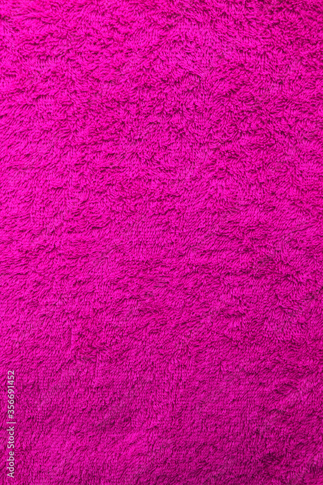 Purple fiber towel texture background. Colorful violet paper terry towel pattern, close up top view. Soft bathroom towel background, cotton textile material one color design Purple fiber towel texture background. Colorful violet paper terry towel pattern, close up top view. Soft bathroom towel background, cotton textile material one color design