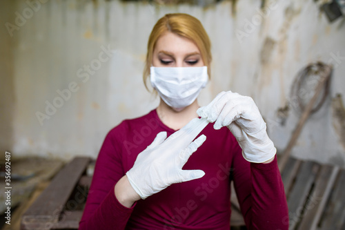 Young woman taking the glows off because of the Coronavirus.