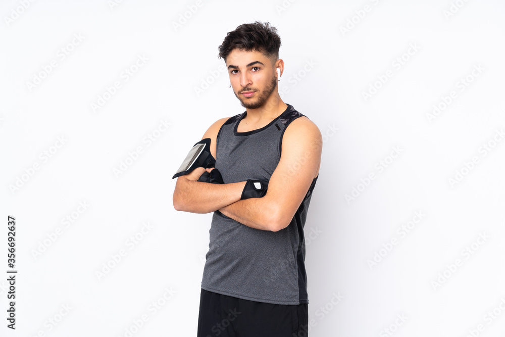 Sport Arabian man isolated on white background with arms crossed Sport Arabian man isolated on white background with arms crossed