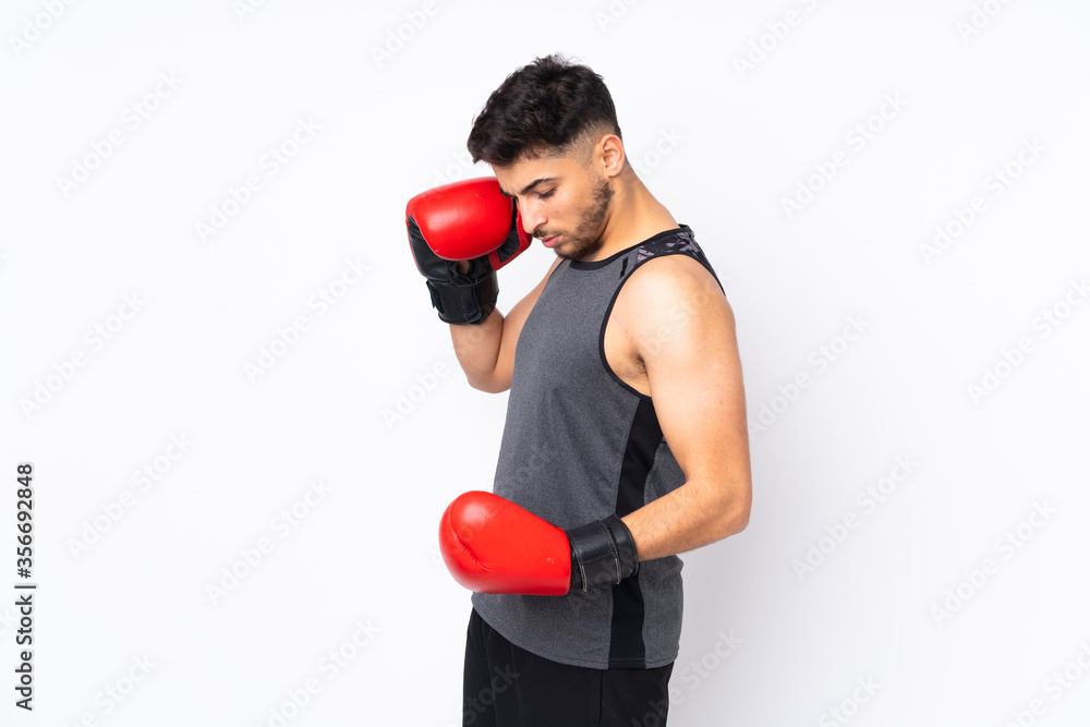 Sport Arabian man isolated on white background with boxing gloves Sport Arabian man isolated on white background with boxing gloves
