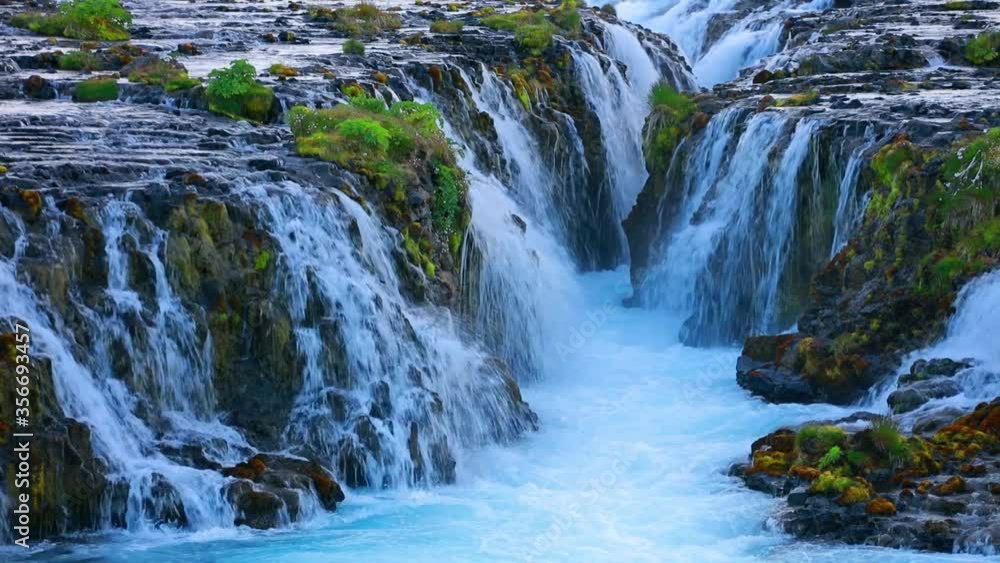 Fantastic sunset on Bruarfoss Waterfall, secluded spot with cascading blue waters. Colorful evening in Iceland, Europe. Beauty of nature concept background. Full HD video (High Definition). Fantastic sunset on Bruarfoss Waterfall, secluded spot with cascading blue waters. Colorful evening in Iceland, Europe. Beauty of nature concept background. Full HD video (High Definition).