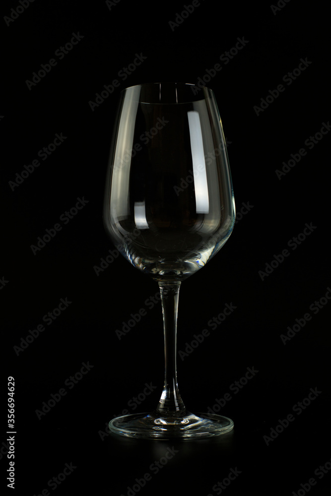Empty wine glass on black background. Empty wine glass on black background.