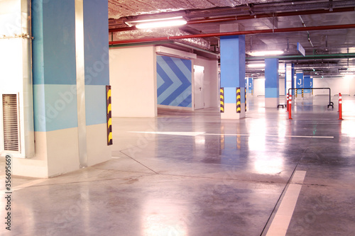 Empty parking garage underground interior in apartment or in sup