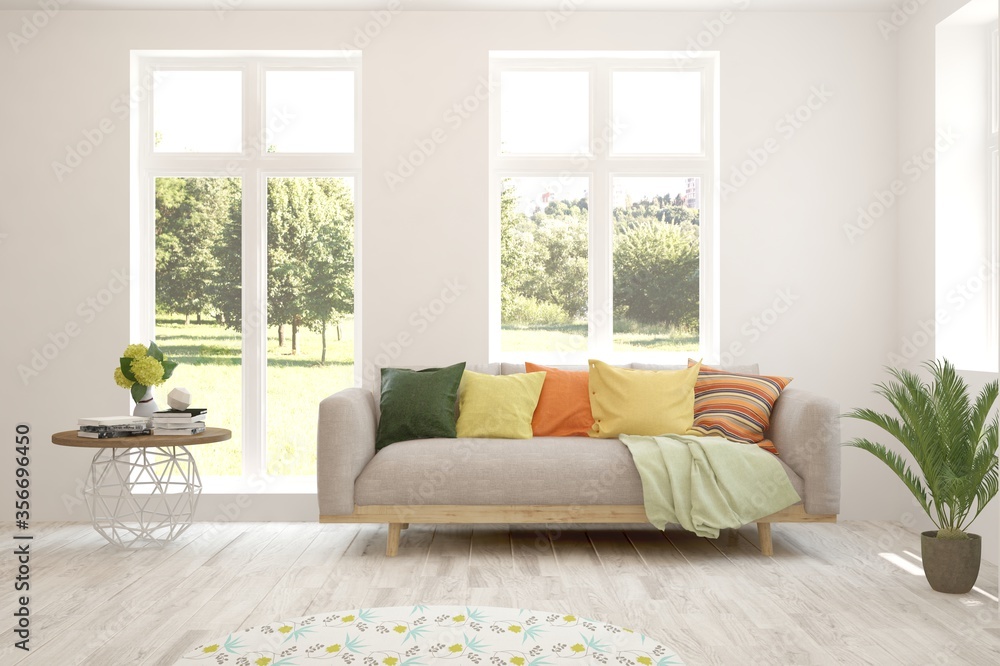 Fototapeta premium White living room with sofa and summer landscape in window. Scandinavian interior design. 3D illustration