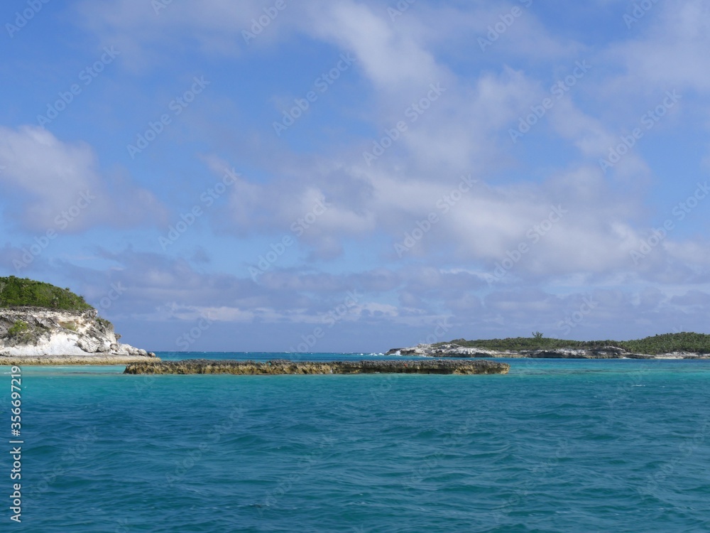 Scattered islands and islets at the Exuma Cays, a popular tourist destination in the Bahamas. Scattered islands and islets at the Exuma Cays, a popular tourist destination in the Bahamas.