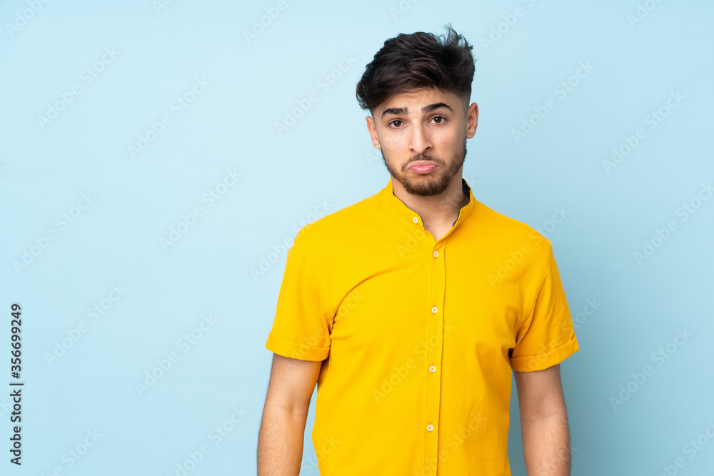Arabian handsome man over isolated background with sad expression Arabian handsome man over isolated background with sad expression