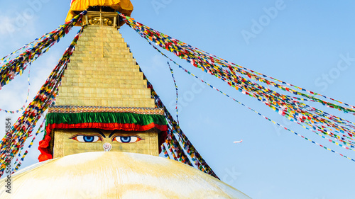 Close up on Buddha eyes on top of the white stupa at Boudhanath, Kathmandu, Nepal photo