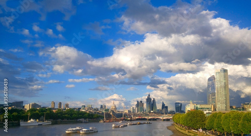 Panorama of City of London and the Thames on a nice summer day. Blue sky with beautiful clouds over London.