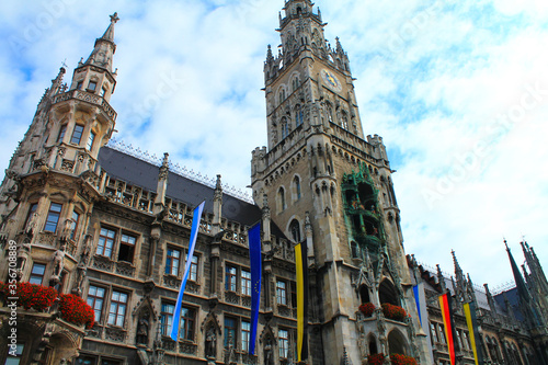 Munich's historic town hall on the Marienplatz square, decorated with flags. Germany.