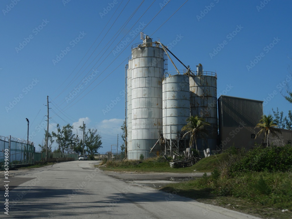 Towering tanks stand by the roadside at a power plant in Nassau, Bahamas