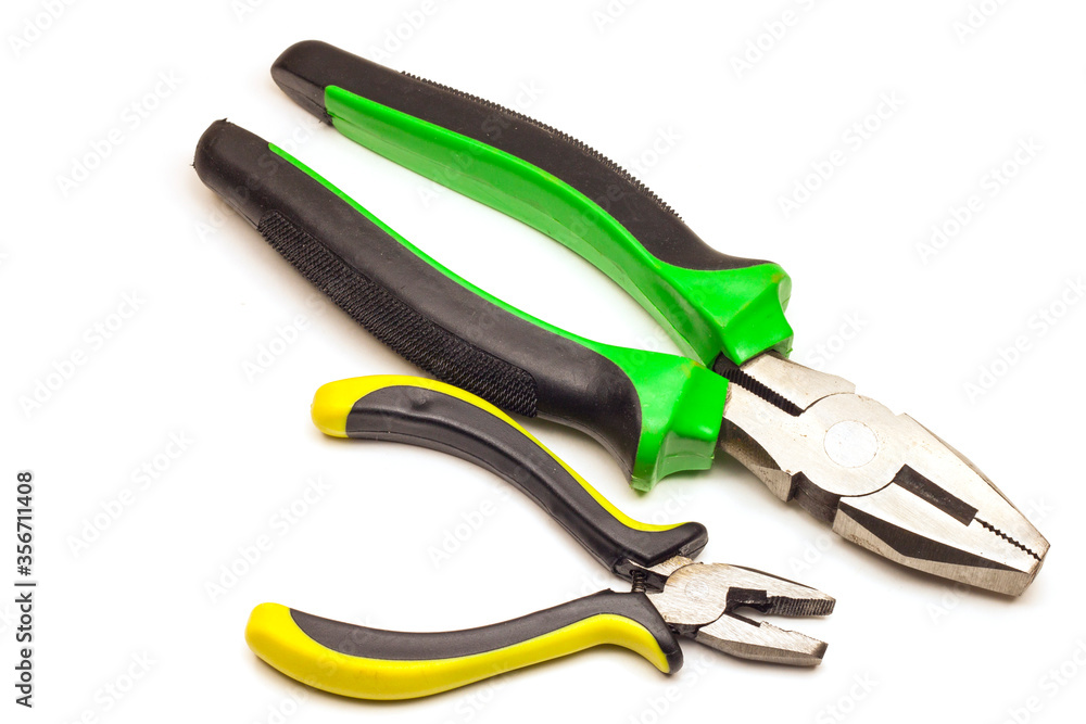 Fototapeta premium two pliers, large and small, with green-black handles and yellow-black handles, on a white background, isolated