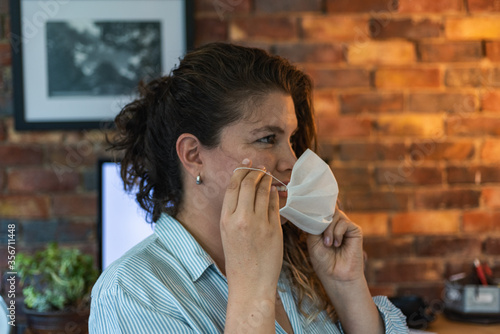 .smiling woman with face mask photo