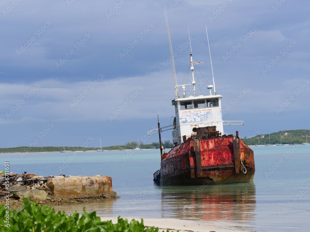 Rusty vessel docked near the shores of George Town, Exuma Cays