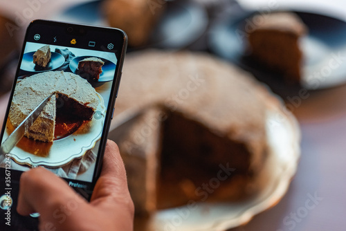 photo of woman spliting a cake photo