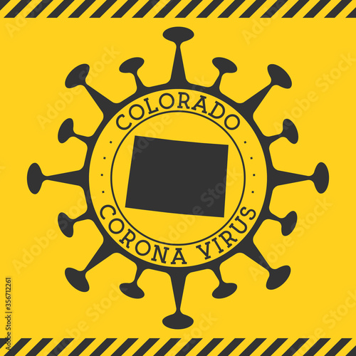 Coronavirus in Colorado sign. Round badge with shape of virus and Colorado map. Yellow US state epidemy lockdown stamp. Vector illustration.