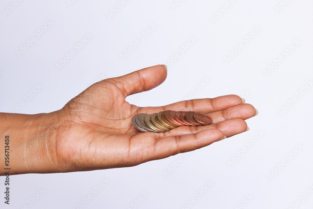 Woman palm showing coins. photo isolate on white side view copy space

S