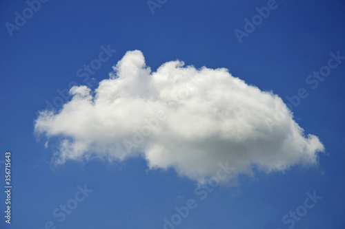 Beautiful cloudscape of nature single white cloud only one on blue sky background in daytime