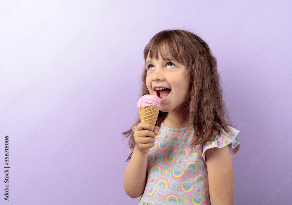 Adorable little girl eat delicious ice cream and look to up. Adorable little girl eat delicious ice cream and look to up.