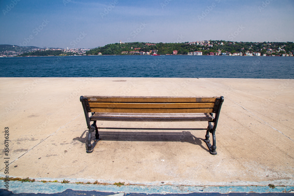 empty wooden benches by the seaside. Istanbul Bosporus. Empty streets of Istanbul from Lock down. Quarantine days in Turkey