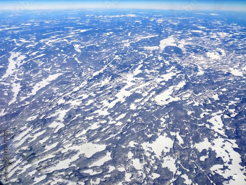Aerial shot above Minnesota with snow covering the ground in winter