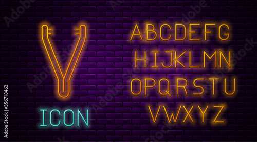 Glowing neon line Medical tweezers icon isolated on brick wall background. Medicine and health. Anatomical tweezers. Neon light alphabet. Vector Illustration.