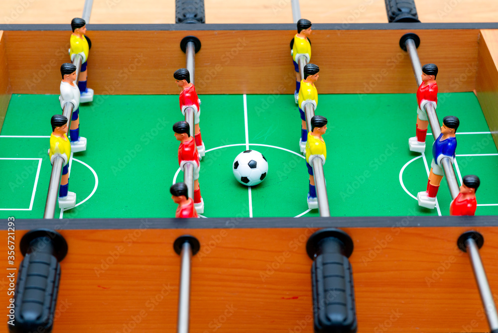 Fototapeta premium Close up table soccer with players and a ball.