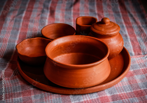 Mud crockery in blurred background photo